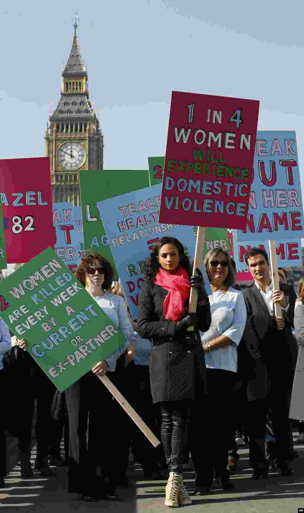 British television presenter Alesha Dixon leads people in a demonstration against domestic violence near Big Ben in the lead up to International Women&#39;s Day, London, March 5, 2013.
