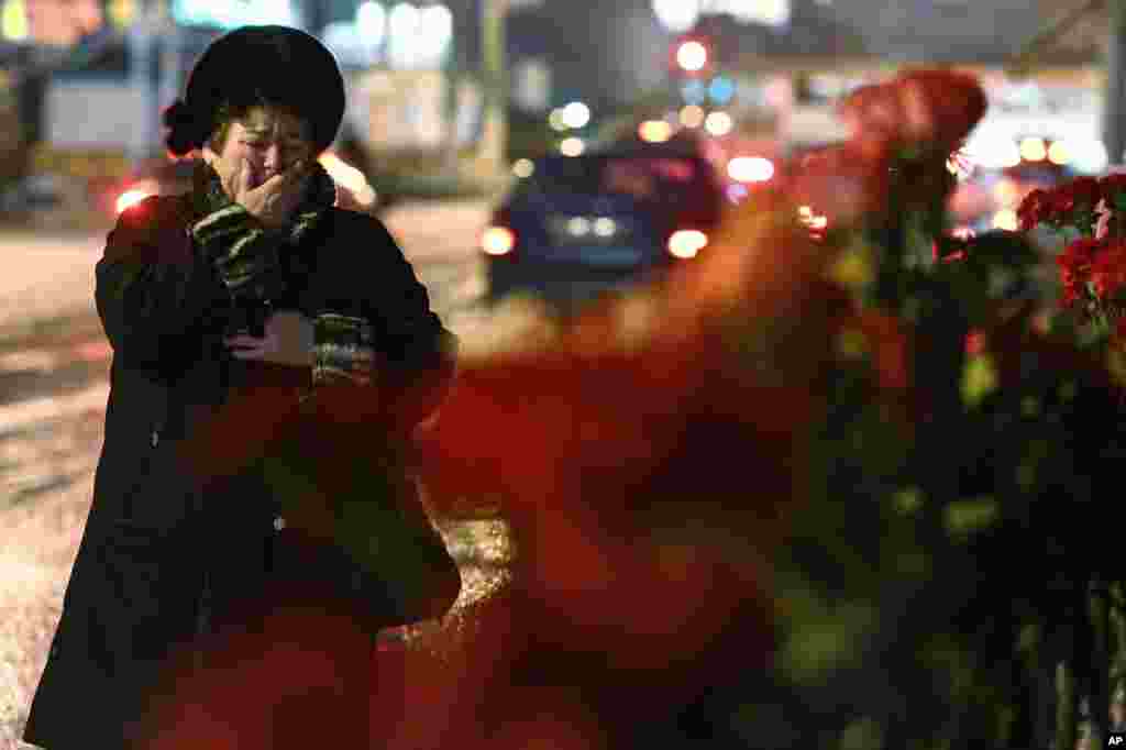 A woman cries outside the main railway station, Volgograd, Russia, Dec. 31, 2013. 