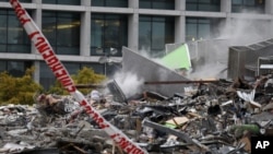 Smoke rises from the collapsed CTV building, that housed a TV broadcaster and an English language school, following Tuesday's earthquake in the southern New Zealand city of Christchurch (File Photo - February 23, 2011)