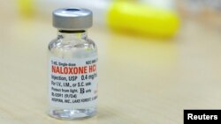 FILE - The drug Naloxone sits on a table during a free Opioid Overdose Prevention Training class provided by Lourdes Hospital in Binghamton, New York, U.S.