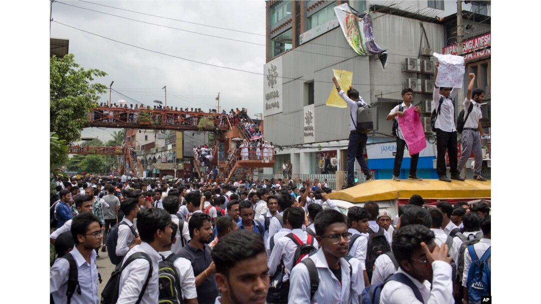 Bangladeshi students shout slogans as they block a road during a protest in Dhaka, Bangladesh, Aug. 1, 2018.