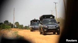 FILE: Army trucks are seen on patrol on the road to Angwan Gata Kaura Local Govt. Area. Taken 3.19.2014