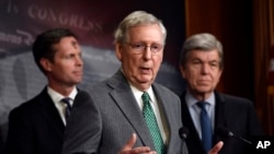 Senate Majority Leader Mitch McConnell of Ky., center, speaks during a news conference on Capitol Hill in Washington, March 6, 2019.