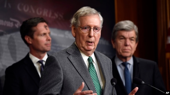 Senate Majority Leader Mitch McConnell of Ky., center, speaks during a news conference on Capitol Hill in Washington, March 6, 2019.