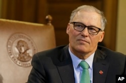 FILE - Washington state Gov. Jay Inslee talks to reporters at the Capitol in Olympia, Washington, April 19, 2017.