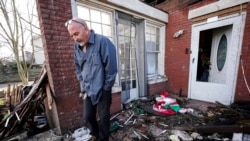 Timothy McDill stands near his tornado-damaged home in Mayfield, Ky., on Dec. 11, 2021.