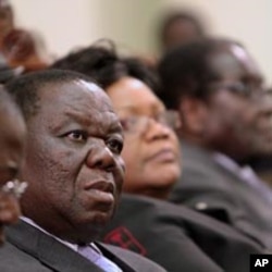 Zimbabwe's Prime Minister Morgan Tsvangirai (L) attends a session at Parliament in Harare (File)