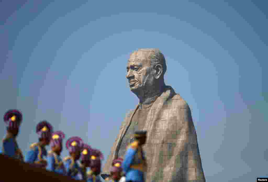 Police officers stand near the &quot;Statue of Unity&quot; portraying Sardar Vallabhbhai Patel, one of the founding fathers of India, during its inauguration in Kevadia, in the western state of Gujarat.
