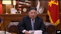 In this undated image from video distributed on Jan. 1, 2019, by North Korean broadcaster KRT, North Korean leader Kim Jong Un delivers a speech in North Korea.