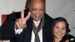 Quincy Jones, left, and Emily Bear arrive at The Recording Academy's 4th Annual "An Evening of Jazz" at The Village Recording Studios, Feb. 6, 2013 in Los Angeles.