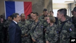 French President Nicolas Sarkozy talks to French troops at the 152nd Infantry Regiment military base in Tora in the region of Surobi, Afghanistan, July 12, 2011.