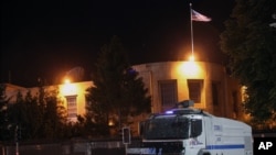FILE - A police vehicle is seen in front of the U.S. Embassy in Ankara, Turkey, June 22, 2013.