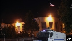 FILE - A police vehicle is seen in front of the U.S. Embassy in Ankara, Turkey, June 22, 2013.