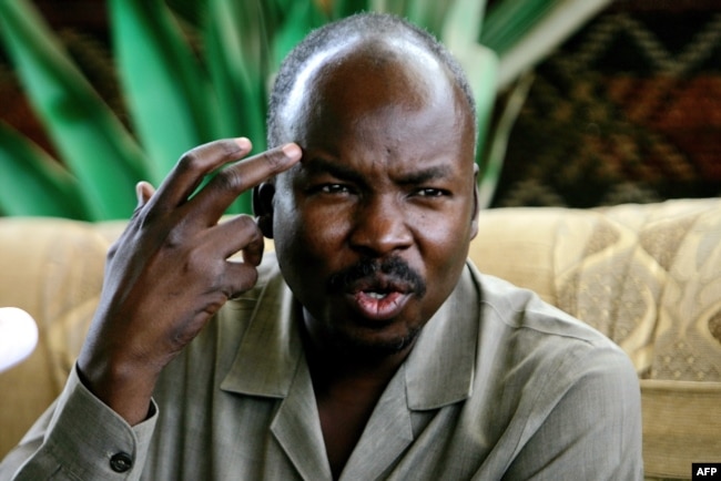 FILE - Ahmed Harun, who then was South Kordofan governor, gestures during a press conference in Talodi, Sudan, April 12, 2012. On April 20, 2019, Harun was one of several leaders of the former ruling National Congress Party who were arrested, a senior party official said.