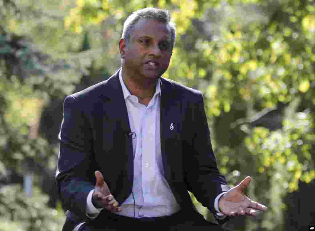 Amnesty International Secretary General Salil Shetty speaks during an interview with The Associated Press in Kyiv, Ukraine, Sept. 7, 2014.