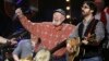 FILE- Musician Pete Seeger (C) performs during a concert celebrating his 90th birthday in New York, May 3, 2009.