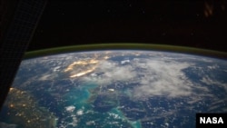A view of Earth from the International Space Station flying above the Caribbean Sea in the early morning hours of July 15, 2014. (NASA astronaut Reid Wiseman photographer)