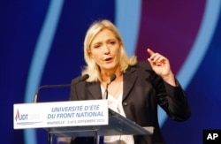 FILE - Leader of France's far-right National Front party Marine Le Pen is seen delivering a speech in Marseille, southern France, Sep. 6, 2015.