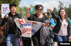 Anti-government protester shouts during a rally calling for a boycott of June presidential elections in Almaty, Kazakhstan, May 1, 2019.