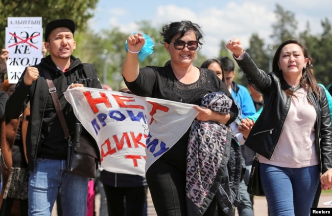 Anti-government protester shouts during a rally calling for a boycott of June presidential elections in Almaty, Kazakhstan, May 1, 2019.