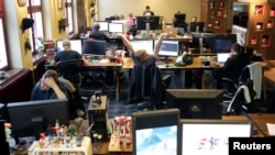 Coders work in the Mojang company office in Stockholm, Sweden, Jan. 21, 2013.