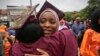Brooklyn College humanities and social sciences graduate Ameera Badamasi, center, from Nigeria, hugs a student after the college's commencement ceremony, where Sen. Bernie Sanders, I-Vt., delivered the keynote address, May 30, 2017.