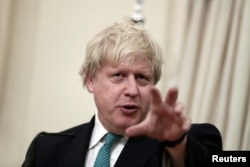 FILE - British Foreign Secretary Boris Johnson answers a question during a joint press conference with Greek Foreign Minister Nikos Kotzias (not pictured) following their meeting at the Foreign Ministry in Athens, Greece, April 6, 2017.