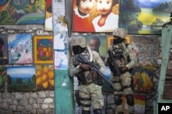 Soldiers patrol in Petion Ville, the neighborhood where the late Haitian President Jovenel Moise lived in Port-au-Prince, Haiti, Wednesday, July 7, 2021.