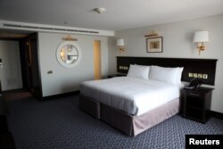 A bedroom is seen inside the Queen Elizabeth II cruise ship, launched as a hotel, in Dubai, UAE, April 18, 2018.