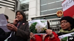 HK activists rally in front of Beijing Liaison Office