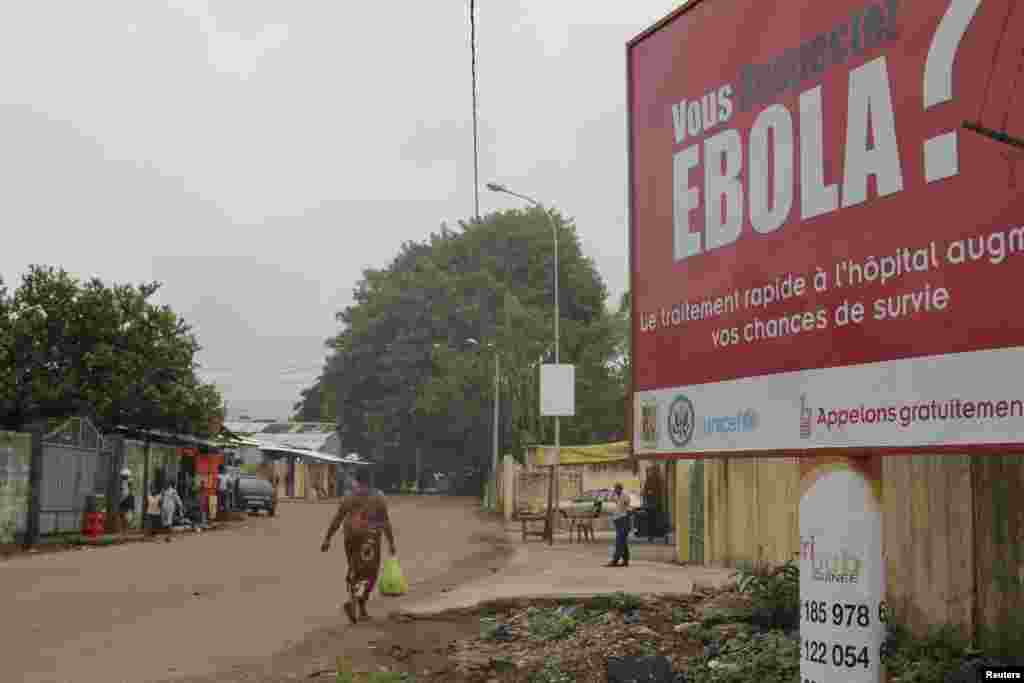 A billboard with a message about Ebola is seen on a street in Conakry, Guinea Oct. 26, 2014.