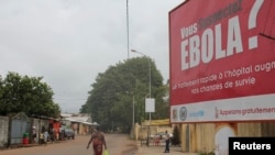 A billboard with a message about Ebola is seen on a street in Conakry, Guinea Oct. 26, 2014.