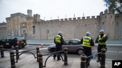 Security fencing and police outside Cardiff Castle ahead of the UK-based NATO summit, in Cardiff, Wales, Sept. 3, 2014.