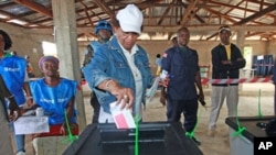 Nobel Peace Prize Laureate Ellen Johnson Sirleaf, who is also Liberia's president and presidential candidate of the Unity Party, votes at a polling station in Feefee in Bomi County, Liberia, October 11, 2011.