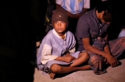 A young boy was among 70 people who was rescued after a boat capsized at St. Martin's Island, Bangladesh, Tuesday, Feb. 11, 2020. (Hai Do/VOA)