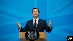 FILE - Britain's Prime Minister David Cameron delivers a speech on immigration at the Home Office in London, May 21, 2015. 