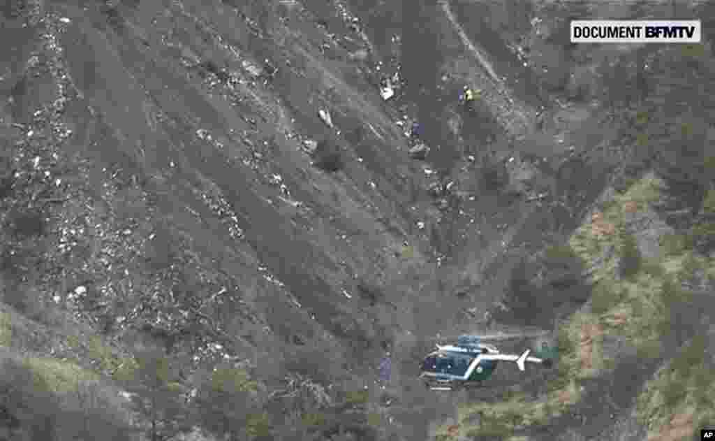 Debris covers an area after a Germanwings Airbus 320 crashed in the French Alps. A Germanwings plane carrying 150 people crashed in a remote section of the French Alps.