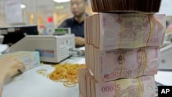 Vietnamese money Dong is seen in Asia Commercial Bank in Hanoi, Vietnam. 