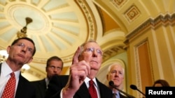 U.S. Senate Majority Leader Mitch McConnell (R) talks to the media, after a weekly Senate Republican caucus luncheon on Capitol Hill in Washington, Feb. 24, 2015.