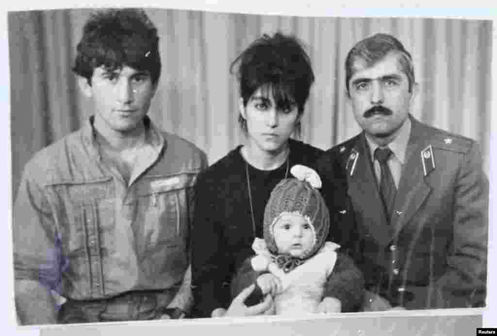 Tamerlan (C, bottom) Tsarnaev, accompanied by his father Anzor (L), mother Zubeidat and uncle Muhamad Suleimanov (R), are pictured in this photo courtesy of the Suleimanova family.