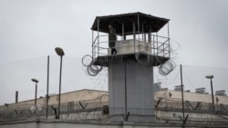 A prison guard stands at a security checkpoint of the prison where former president Mikheil Saakashvili is being held, in Rustavi, about 20 km from the capital Tbilisi, Georgia, Oct. 3, 2021.