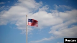 FILE - A U.S. flag is seen in Normal, Ill., March 30, 2011. 