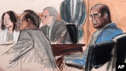 In this courtroom sketch, defendant John Ashe, right, sits in court during his arraignment on bribery charges in New York, Oct. 6, 2015. 