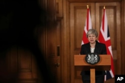 Britain's Prime Minister Theresa May delivers a statement, at 10 Downing Street, in London, March 20, 2019. May says it's a matter of "great personal regret" that U.K. won't leave the EU with a deal on March 29.