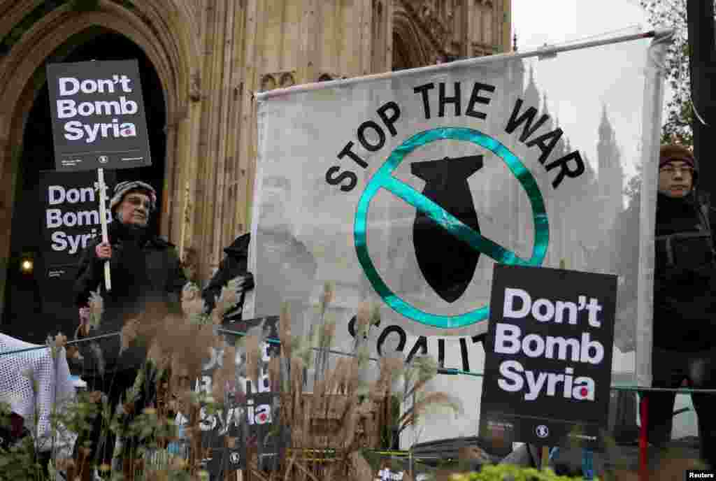 Anti-war protesters demonstrate outside the Houses of Parliament in London, Britain.