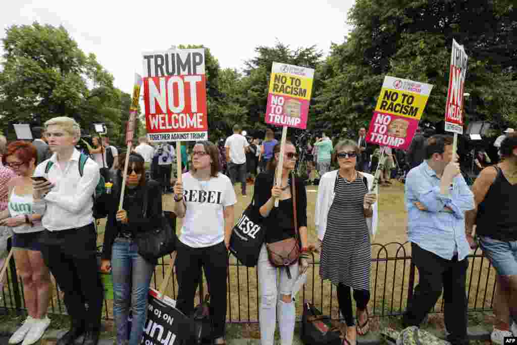 Protesters against the visit of U.S. President Donald Trump gather near an entrance to the American ambassador&#39;s residence, Winfield House, in the Regents Park section of London.