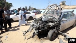 Libyans gather at the site of an attack on a checkpoint in the city of Zliten, 170 km east of the capital Tripoli, Aug. 23, 2018. The attack killed six soldiers of the UN-backed unity government, an interior ministry source said.