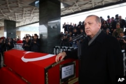 Turkey's President Recep Tayyip Erdogan speaks during the funeral prayers for Sergeant Musa Ozalkan, the first Turkish soldier to be killed in Turkey's cross-border Operation Olive Branch in northern Syria, in Ankara, Turkey, Jan. 23, 2018.