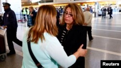Homa Homaei, a U.S. citizen from Iran, is embraced by a lawyer working to help her Iranian family members affected by a U.S. presidential executive order on immigration, at Los Angeles International Airport in Los Angeles, Jan. 28, 2017.