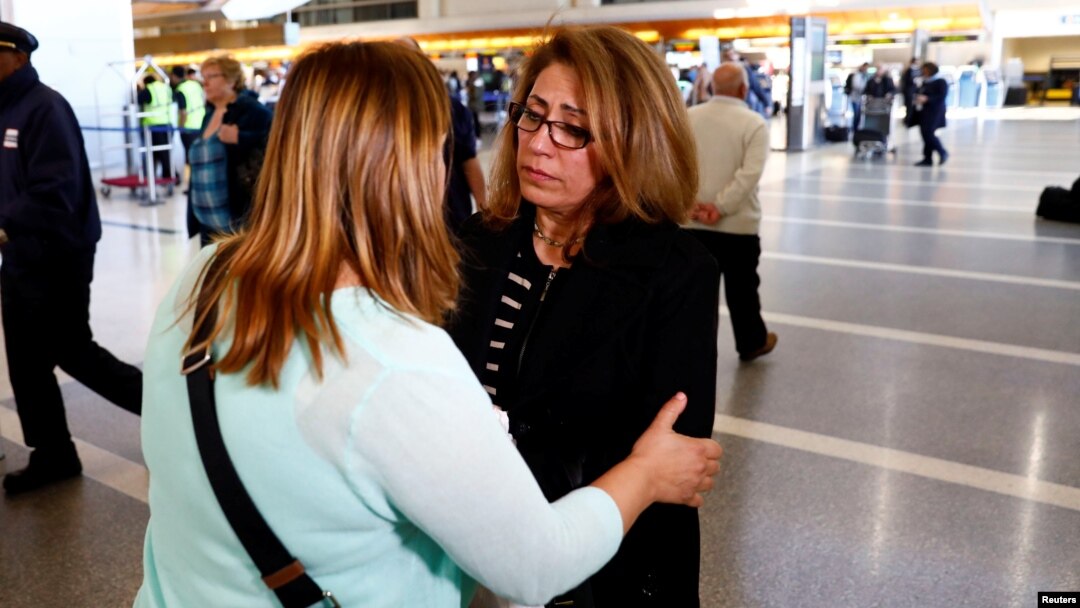 Homa Homaei, a U.S. citizen from Iran, is embraced by a lawyer working to help her Iranian family members affected by a U.S. presidential executive order on immigration, at Los Angeles International Airport in Los Angeles, Jan. 28, 2017.